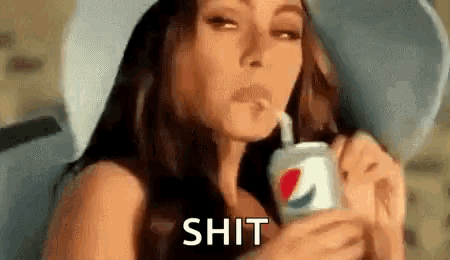 a woman is drinking a pepsi with a straw .
