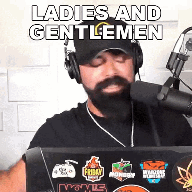 a man wearing headphones and a hat is talking into a microphone with the words ladies and gentlemen above him