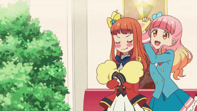 two anime girls are standing next to each other and one of them has a crown on her head