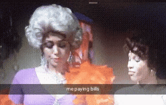 a woman in a wig says me paying bills in a snapchat