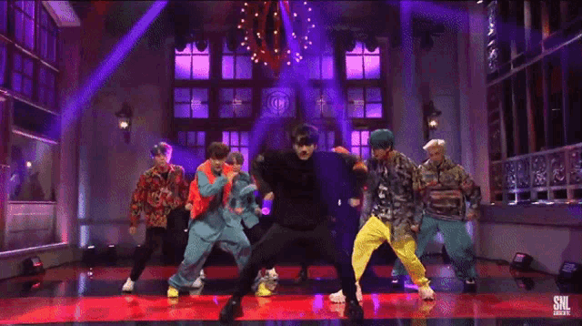 a group of people dancing with the words you 're welcome in the corner