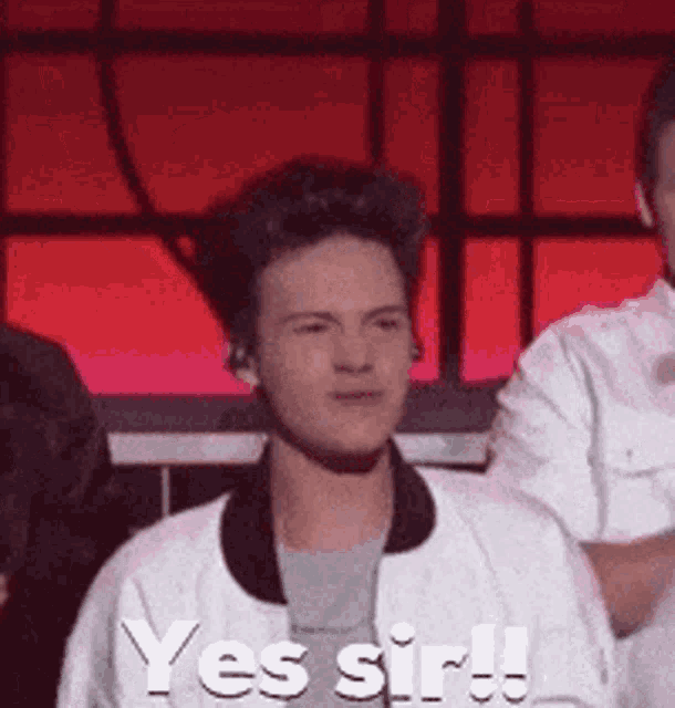 a young man in a white jacket says yes sir .