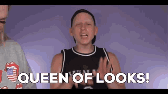 a man in a basketball jersey is saying `` queen of looks ! ''