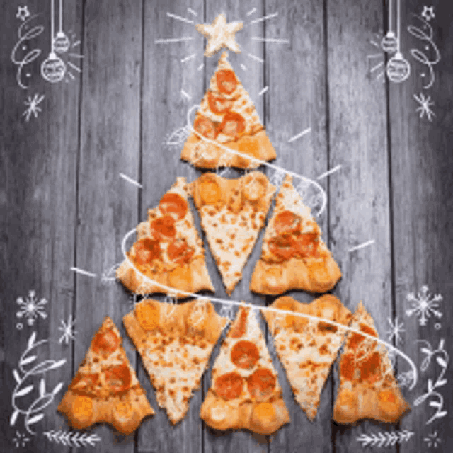 a christmas tree made out of pizza slices on a wooden table