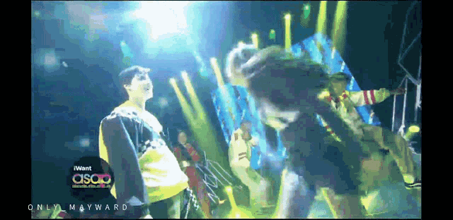 a group of people dancing on a stage with the words i want asap on the bottom left