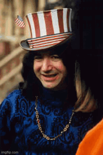 a man wearing a top hat with a flag on it
