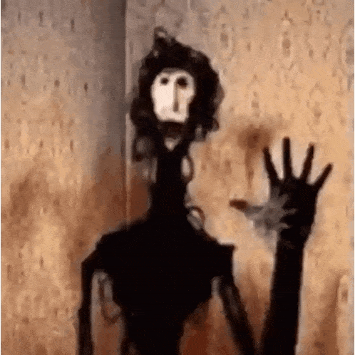 a cartoon character with a long neck and arms is waving at the camera in a room .