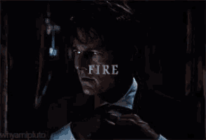 a close up of a man 's face with the word fire on his face