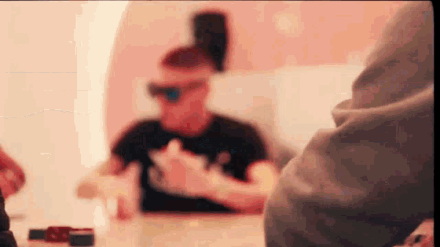 a blurry photo of a man wearing sunglasses