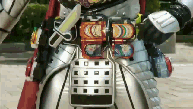 a close up of a person wearing a samurai armor with a knife and a sword on their belt .