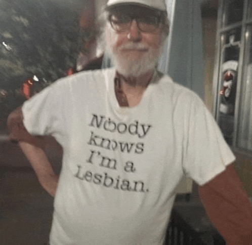 a man wearing a t-shirt that says " nobody knows i 'm a lesbian "