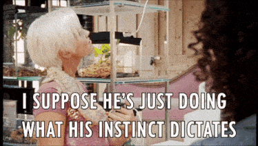 a woman with a snake around her neck says " i suppose he 's just doing what his instinct dictates
