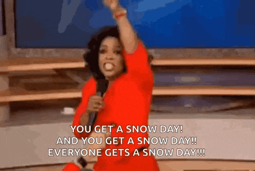 a woman in a red dress is holding a microphone and says you get a snow day