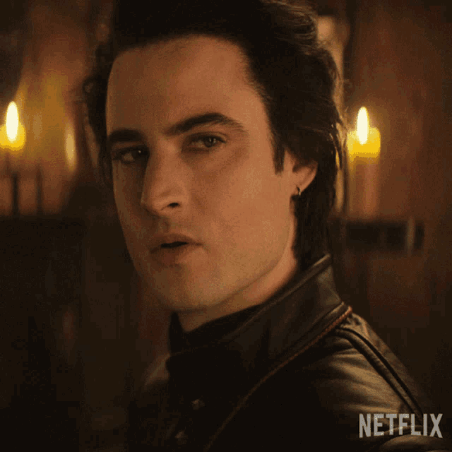 a close up of a man 's face with the netflix logo in the corner