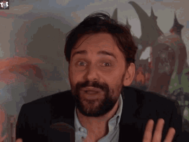 a man with a beard is making a funny face with the words not tr written below him
