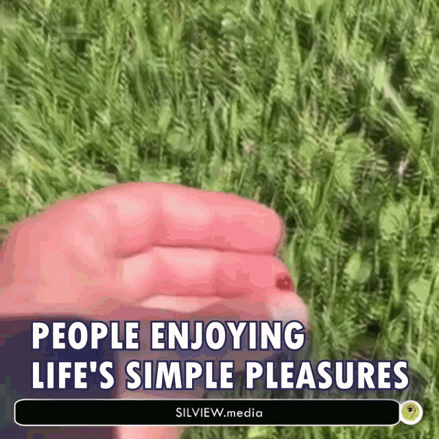 a person 's hand with a red spot on it and the words " people enjoying life 's simple pleasures "