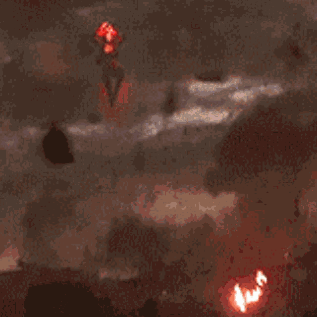 a blurry picture of a red light with a dark background