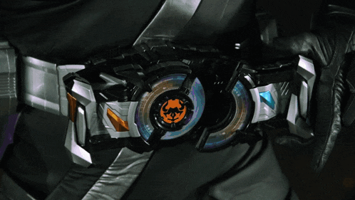 a person is wearing a belt with a purple and blue circle on it