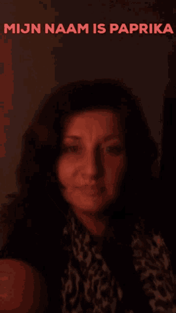 a woman with her eyes closed and the words mijn naam is paprika on the bottom
