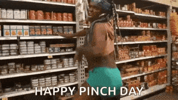 a woman is dancing in a grocery store with the words `` happy pinch day '' written below her .