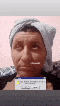 a woman with a towel wrapped around her head has a fatal error restart your life in me dos mode