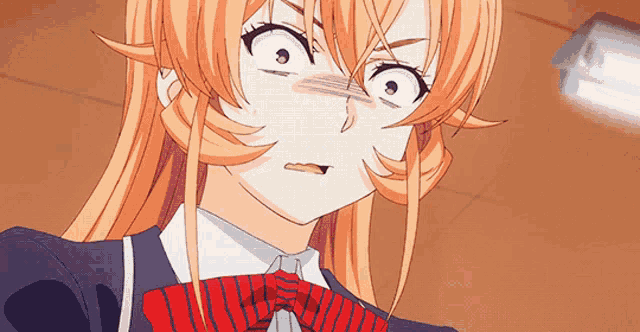 a close up of a girl with orange hair and a red tie