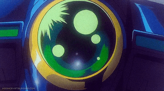 a close up of a green and yellow object with the website mooncrystalpower.com in the bottom right corner