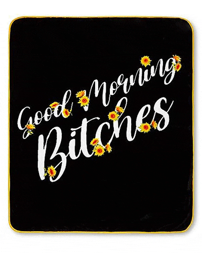 a black blanket with the words `` good morning bitches '' and yellow sunflowers on it .
