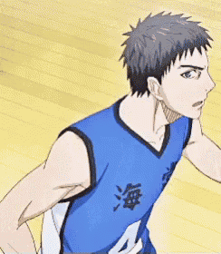 a basketball player wearing a blue jersey with chinese characters on it is standing on a court .