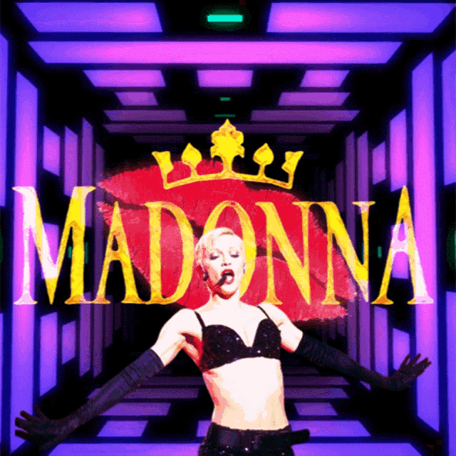 a woman singing in front of a sign that says madonna on it