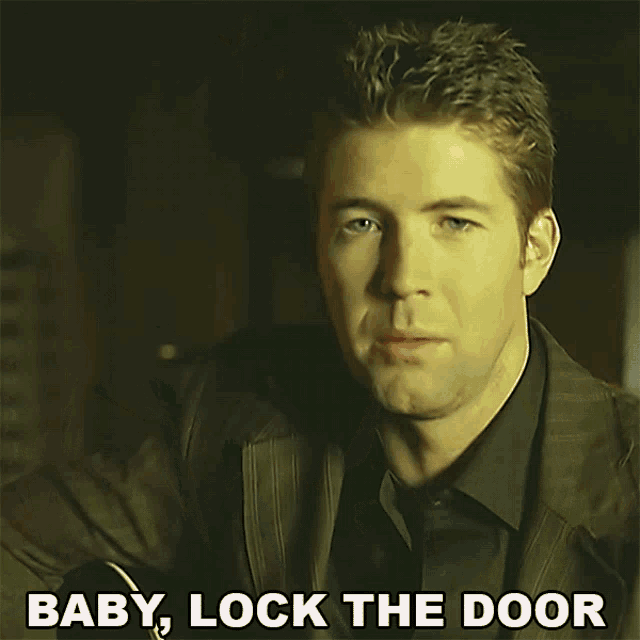 a man in a suit says baby lock the door in a video