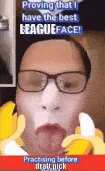 a man with glasses and a banana in his mouth is practicing before draft pick