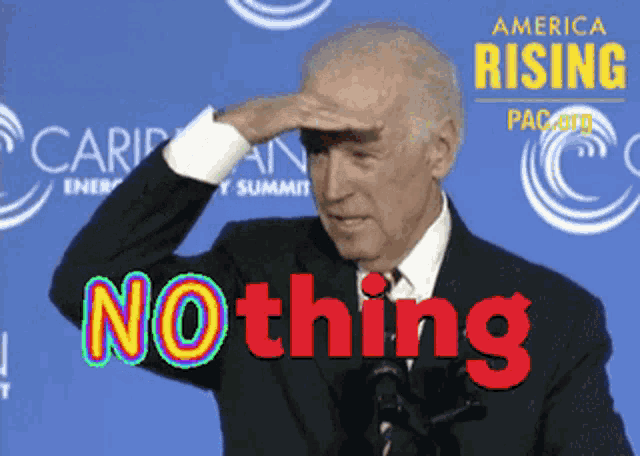 a man in a suit holds his hand to his forehead in front of a sign that says " america rising "