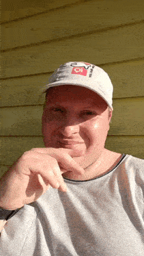 a man wearing a white hat that says ' io ' on it