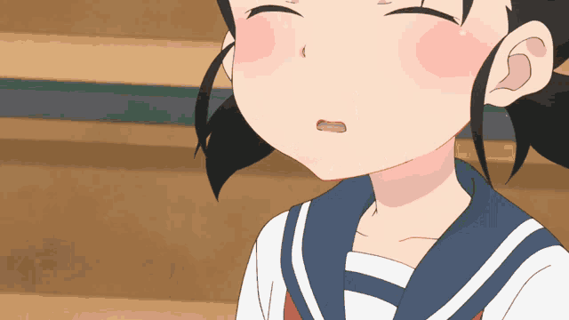a close up of a girl 's face with her mouth open