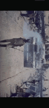 a blurry picture of a group of people standing on a street