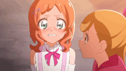 two anime girls are looking at each other and one has an x on her head