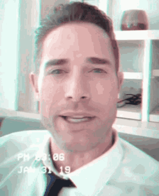 a man in a white shirt and tie is smiling with the date january 31 on the bottom right