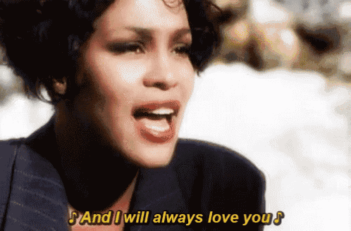 a close up of a woman singing and saying " and i will always love you "