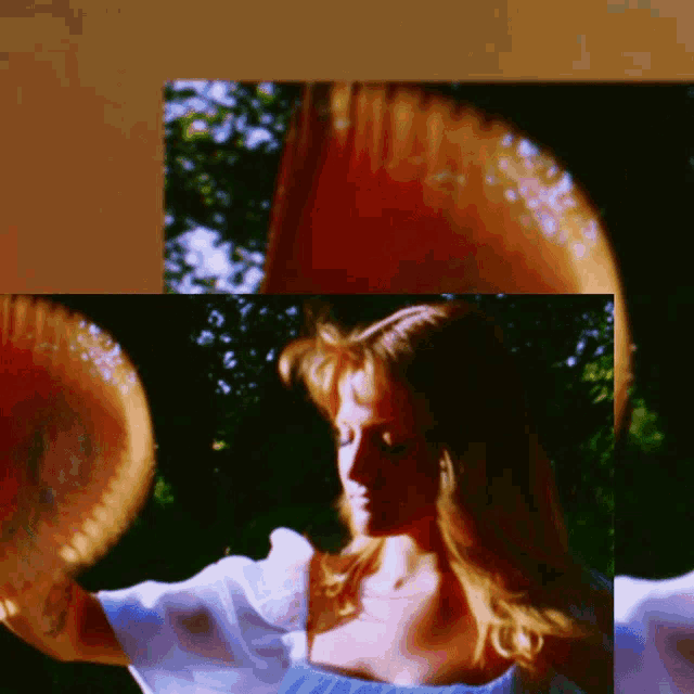a woman in a blue dress is holding a bowl in her hand