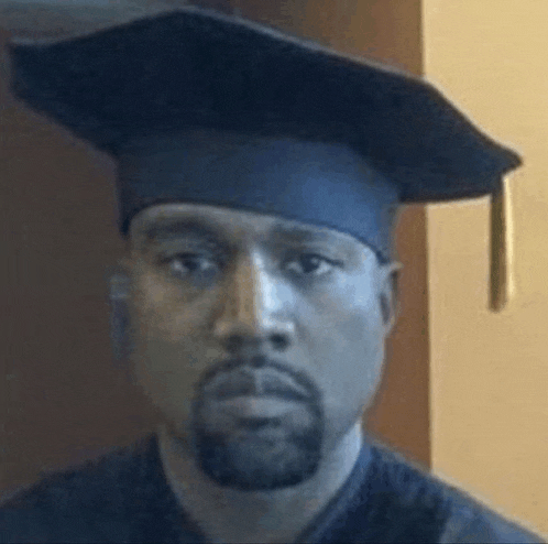 kanye west is wearing a graduation cap and gown and looking at the camera .