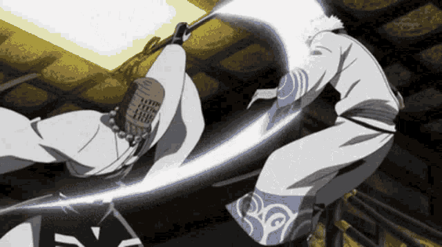 two anime characters are fighting with swords and one of them has the letter y on his back