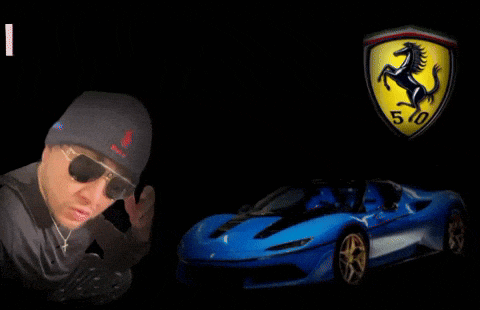a man wearing sunglasses stands next to a blue ferrari car