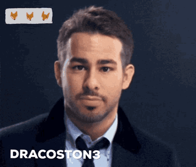 a man in a suit and tie with the name dracoston3 written below him