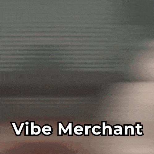 a blurry picture of a person with the words vibe merchant written below them