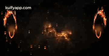 there are two circles of fire in the middle of the image .