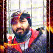a man with a beard wearing a beanie and a jacket