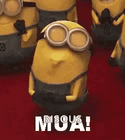 a group of minions are standing next to each other and one of them is wearing goggles and says bisous moa !