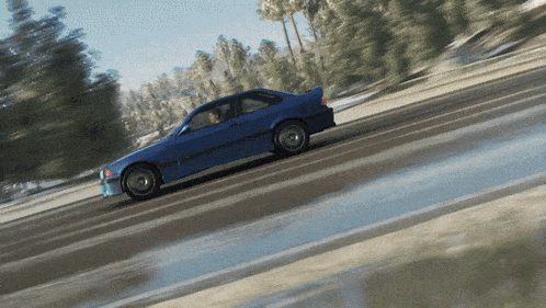 a blue car is driving down a road in a video game