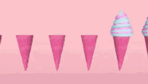 three pink ice cream cones with different flavors on a pink background .